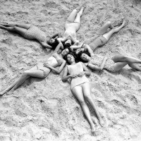 Six shapely lasses hit the beach at Coney Island, 1960