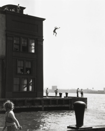 A handout photo shows a 1948 gelatin silver print taken by Ruth Orkin named "Boy Jumping into Hudson River".